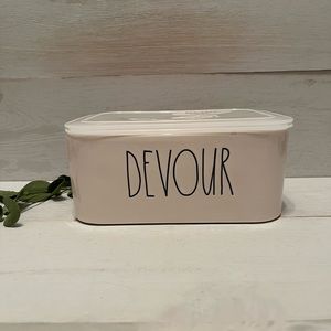 Rae Dunn DEVOUR leftover ceramic container with sealed lid.
